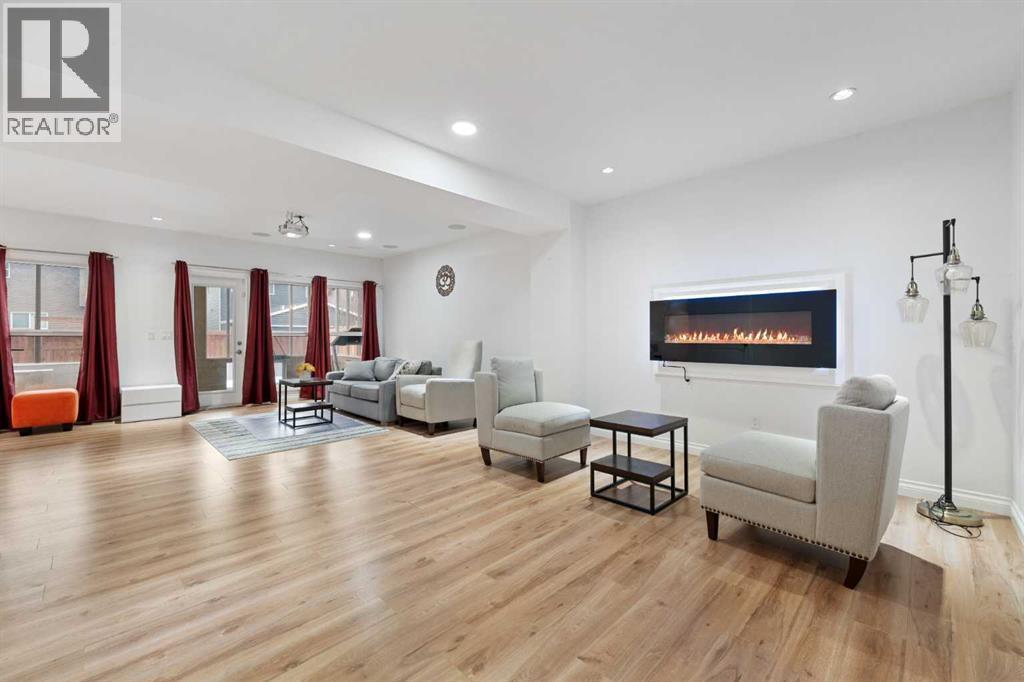99 Evansglen Circle Nw, Calgary, AB - Indoor Photo Showing Living Room With Fireplace