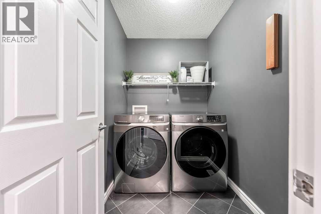 361 Cimarron Boulevard, Okotoks, AB - Indoor Photo Showing Laundry Room