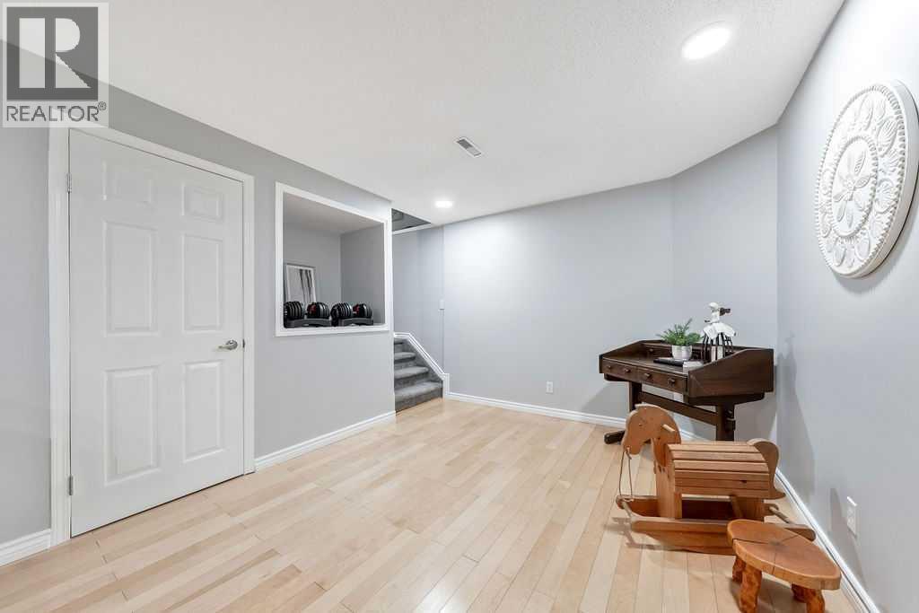 Designed for flexibility, the lower-level space suits a variety of lifestyle needs - 361 Cimarron Boulevard, Okotoks, AB - Indoor Photo Showing Other Room