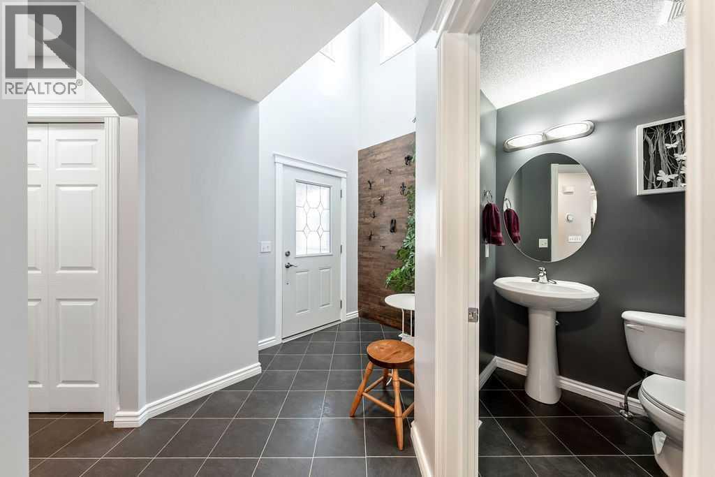 An inviting, oversized mudroom that keeps daily life organized - 361 Cimarron Boulevard, Okotoks, AB - Indoor Photo Showing Bathroom