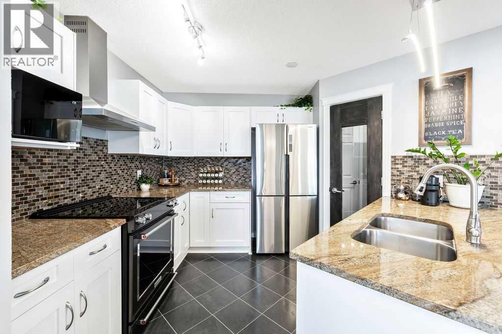 361 Cimarron Boulevard, Okotoks, AB - Indoor Photo Showing Kitchen With Stainless Steel Kitchen With Double Sink With Upgraded Kitchen