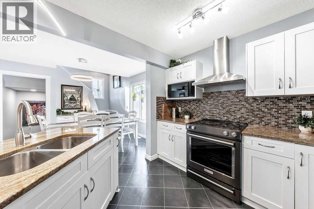361 Cimarron Boulevard, Okotoks, AB - Indoor Photo Showing Kitchen With Double Sink With Upgraded Kitchen