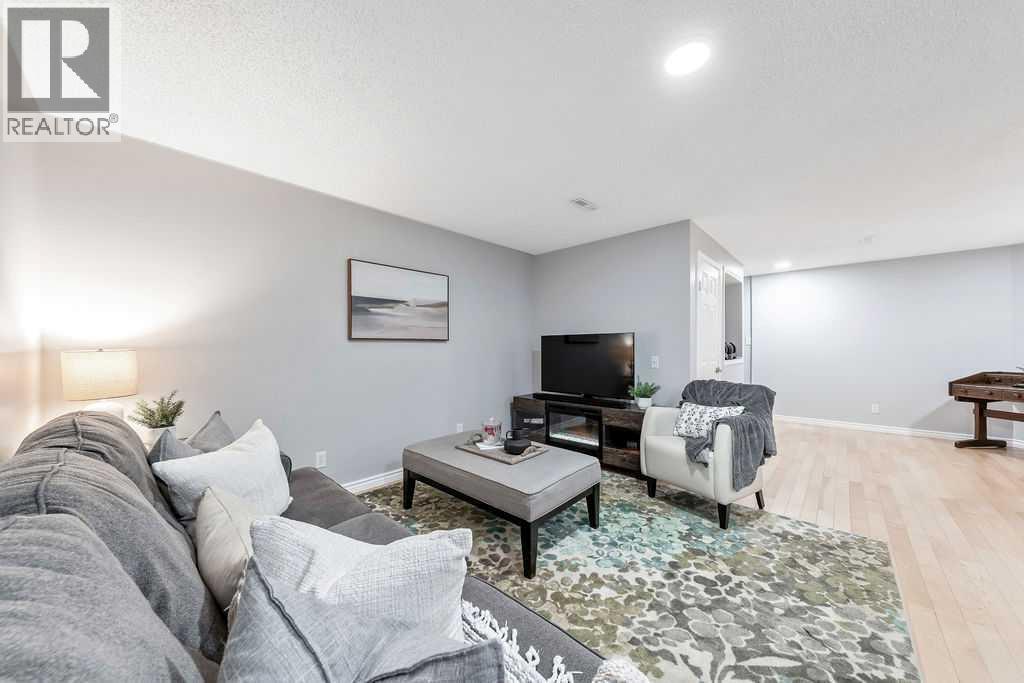 Lower-level family room - 361 Cimarron Boulevard, Okotoks, AB - Indoor Photo Showing Living Room