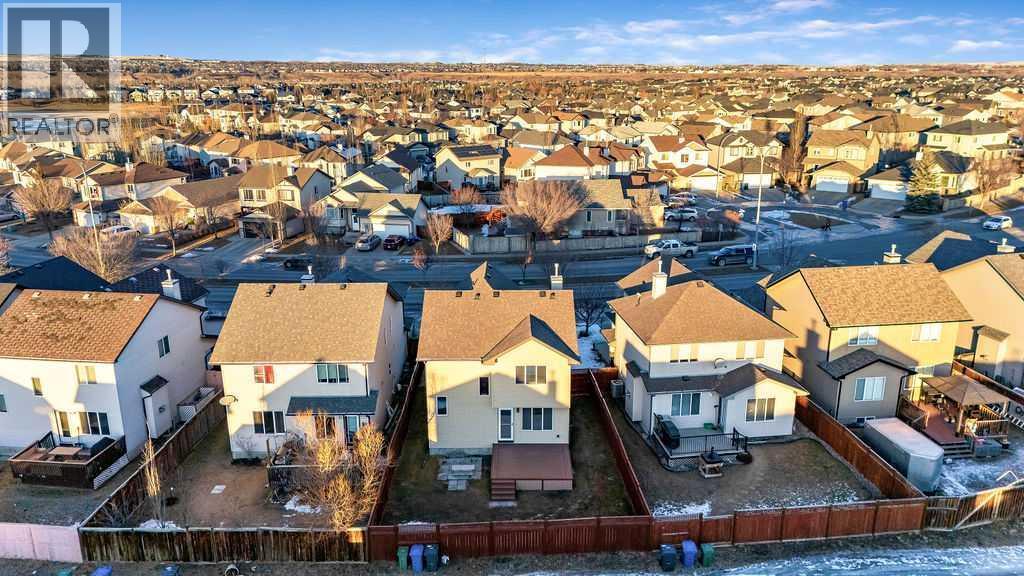 Backing onto a laneway, the home enjoys enhanced spacing and an open feel - 361 Cimarron Boulevard, Okotoks, AB - Outdoor