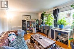 Living area featuring wood finished floors -