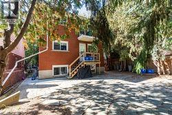 Back of property featuring brick siding -