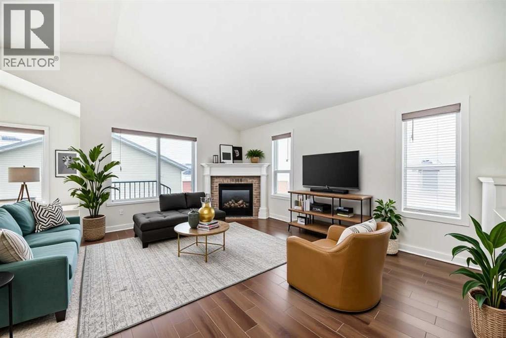 226 Saddlebrook Circle Ne, Calgary, AB - Indoor Photo Showing Living Room With Fireplace