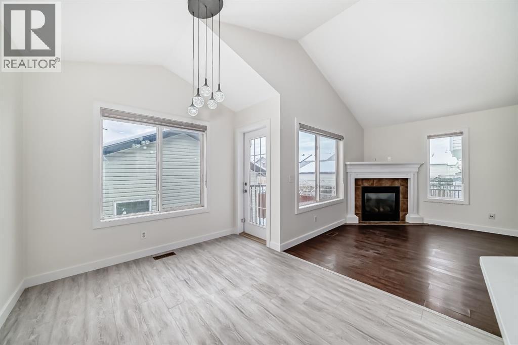 226 Saddlebrook Circle Ne, Calgary, AB - Indoor Photo Showing Living Room With Fireplace