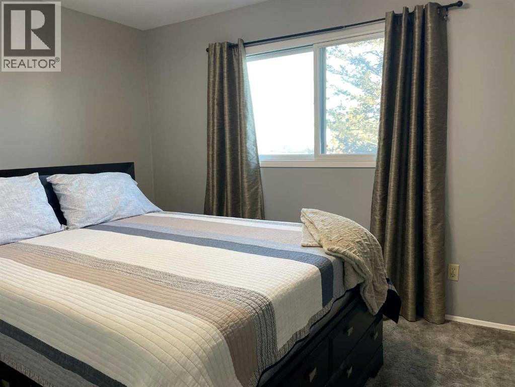 #2-Bedroom - Primary only room with carpet - 4516 45 Street, Rycroft, AB - Indoor Photo Showing Bedroom