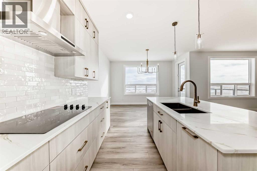 100 Corner Glen Manor Ne, Calgary, AB - Indoor Photo Showing Kitchen With Double Sink With Upgraded Kitchen