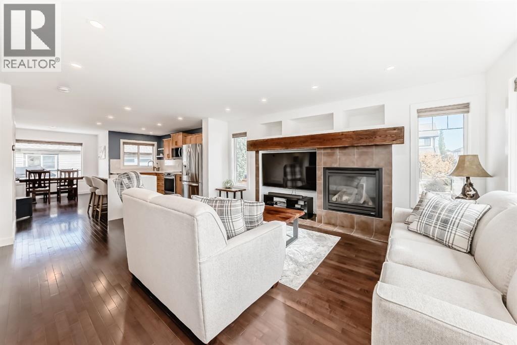 182 Sunset Heights, Cochrane, AB - Indoor Photo Showing Living Room With Fireplace