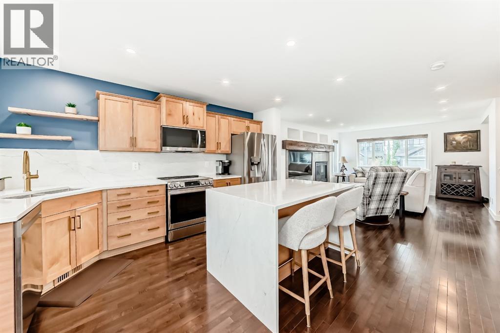 182 Sunset Heights, Cochrane, AB - Indoor Photo Showing Kitchen With Upgraded Kitchen