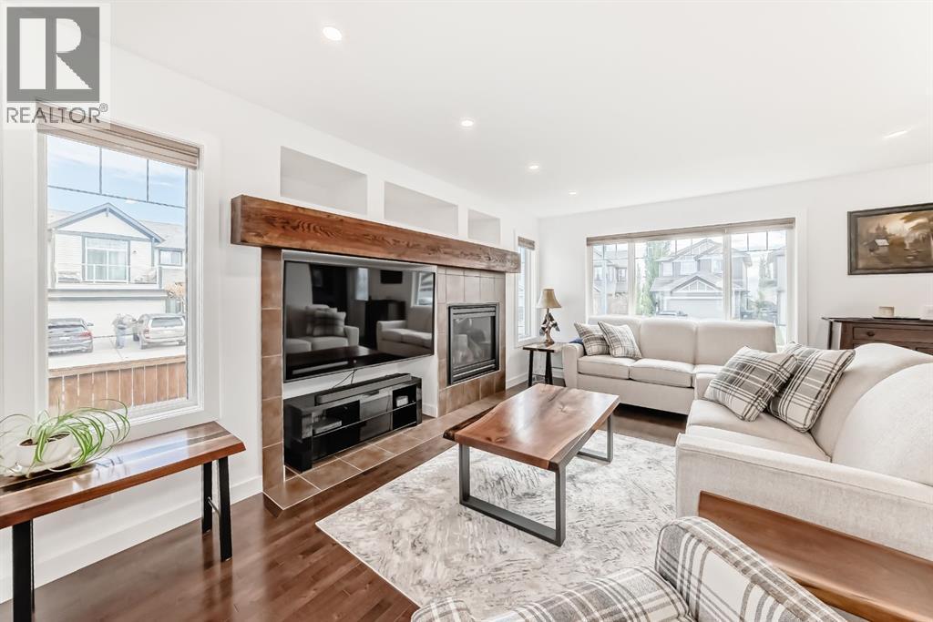182 Sunset Heights, Cochrane, AB - Indoor Photo Showing Living Room With Fireplace