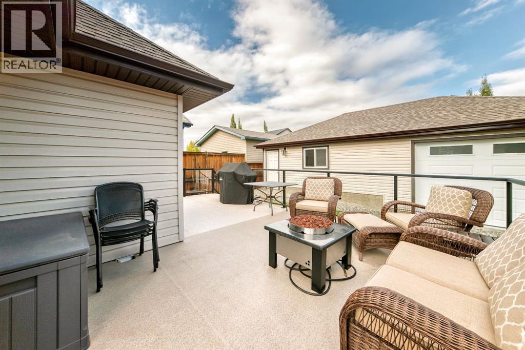 182 Sunset Heights, Cochrane, AB - Outdoor With Deck Patio Veranda With Exterior