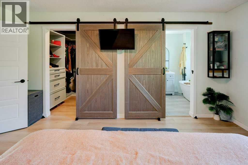 Barn doors to ensuite and walk-in closet - 15 Chaparral Crescent Se, Calgary, AB - Indoor