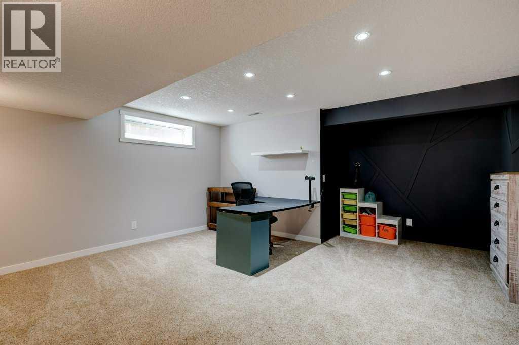 Basement recreation room - 15 Chaparral Crescent Se, Calgary, AB - Indoor