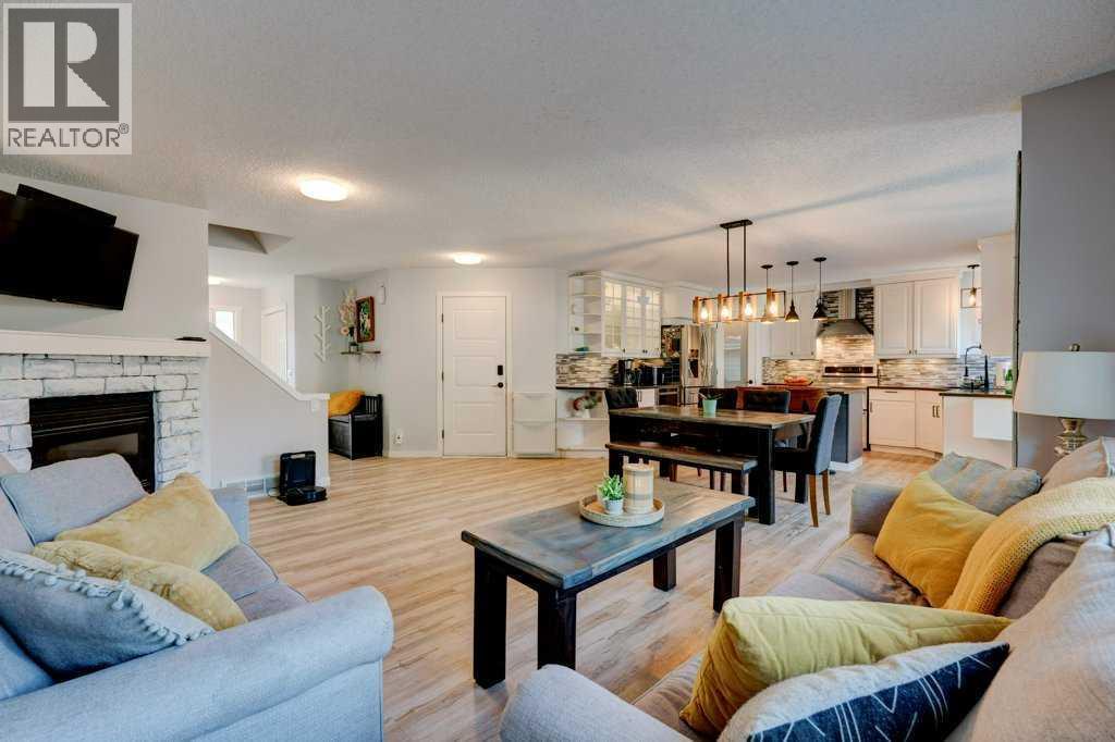 Extra large family room - 15 Chaparral Crescent Se, Calgary, AB - Indoor Photo Showing Living Room With Fireplace