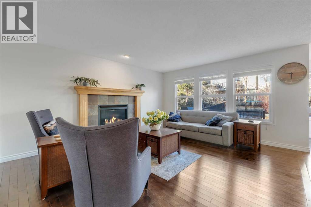 29 Sunset Close, Cochrane, AB - Indoor Photo Showing Living Room With Fireplace