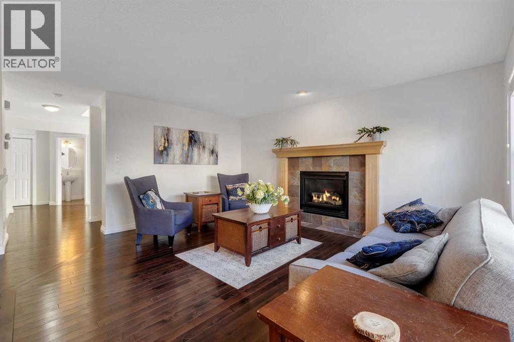 29 Sunset Close, Cochrane, AB - Indoor Photo Showing Living Room With Fireplace