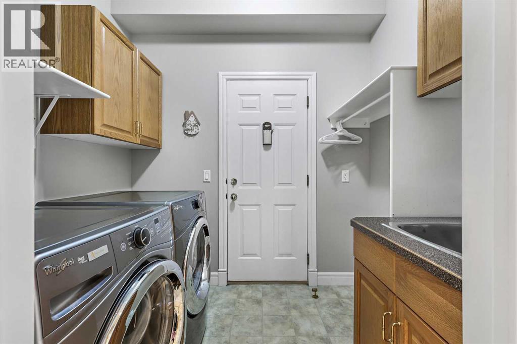 69 Evergreen Crescent Sw, Calgary, AB - Indoor Photo Showing Laundry Room