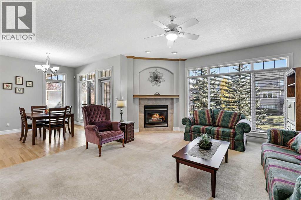 69 Evergreen Crescent Sw, Calgary, AB - Indoor Photo Showing Living Room With Fireplace
