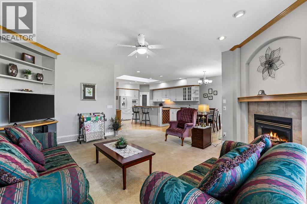 69 Evergreen Crescent Sw, Calgary, AB - Indoor Photo Showing Living Room With Fireplace