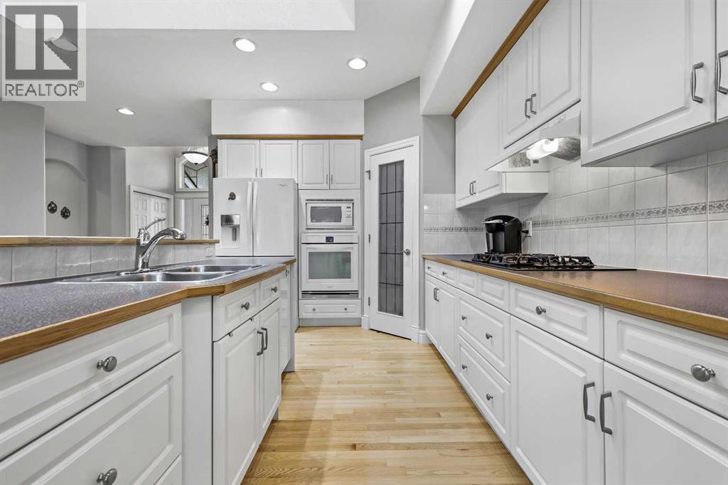 69 Evergreen Crescent Sw, Calgary, AB - Indoor Photo Showing Kitchen With Double Sink