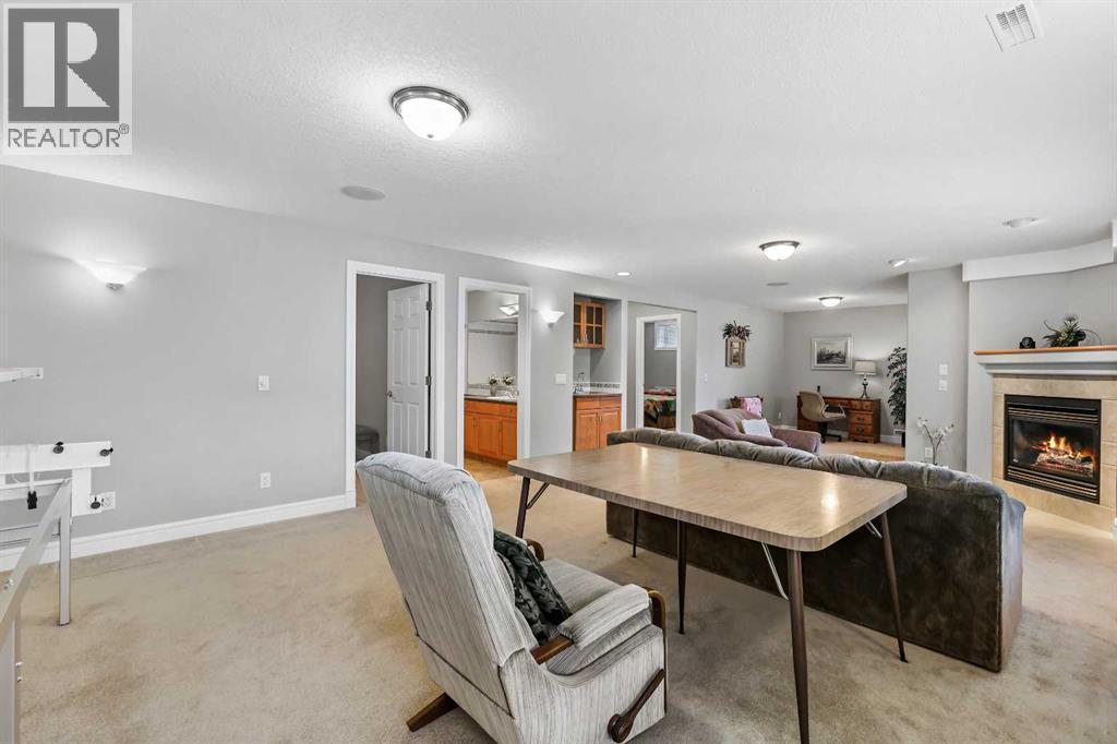 69 Evergreen Crescent Sw, Calgary, AB - Indoor With Fireplace