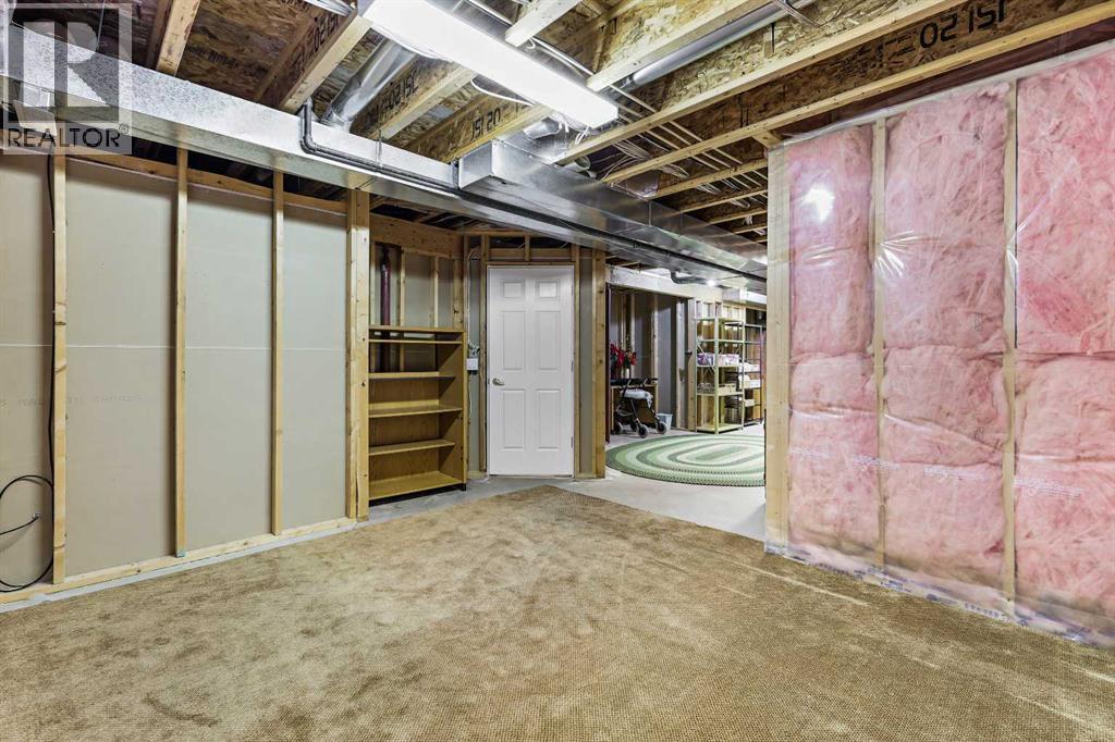 69 Evergreen Crescent Sw, Calgary, AB - Indoor Photo Showing Basement