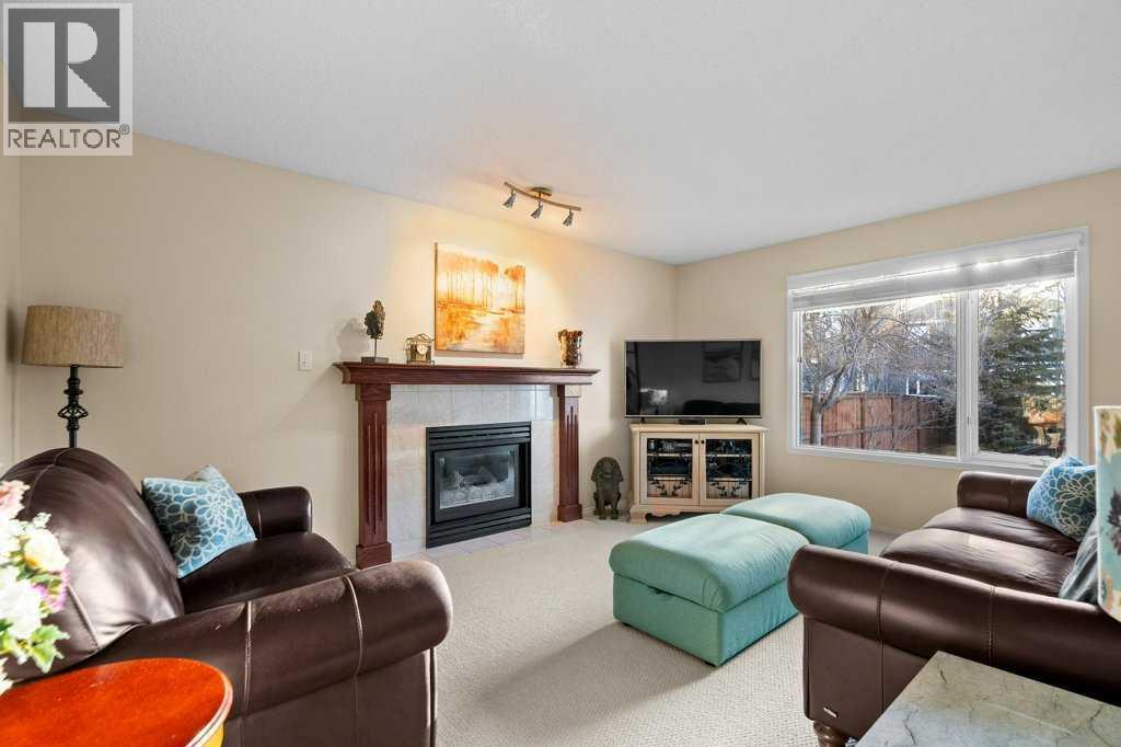 63 Douglas Park Boulevard Se, Calgary, AB - Indoor Photo Showing Living Room With Fireplace