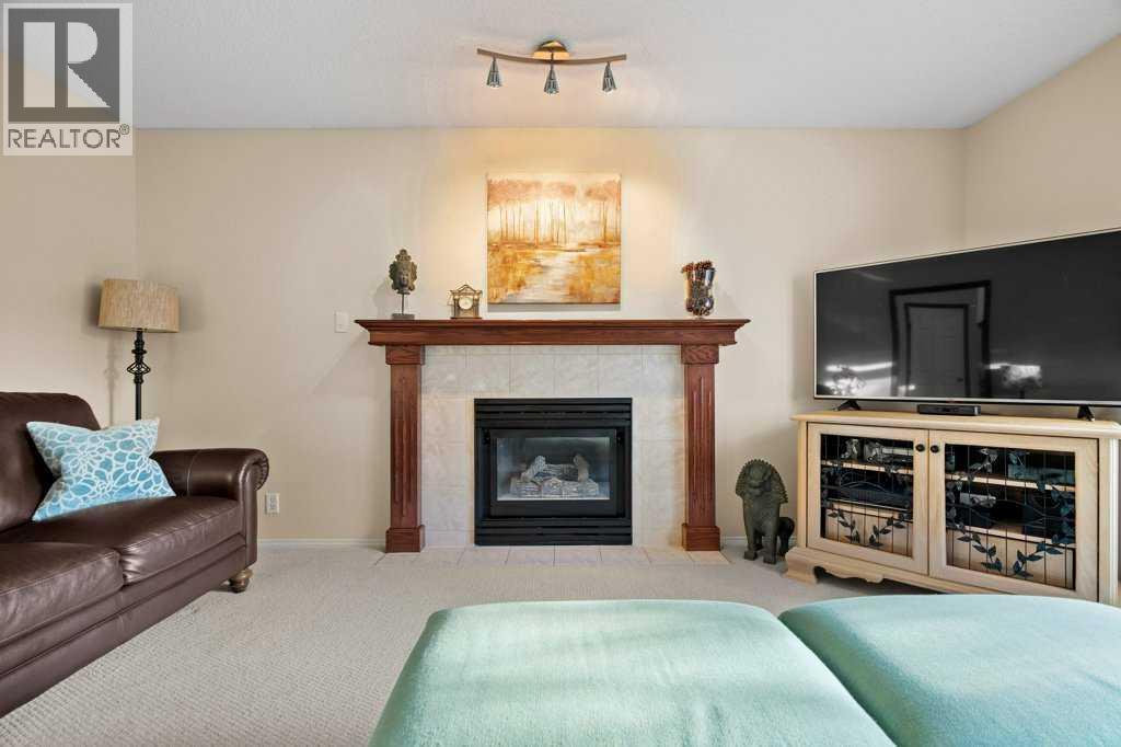 63 Douglas Park Boulevard Se, Calgary, AB - Indoor Photo Showing Living Room With Fireplace