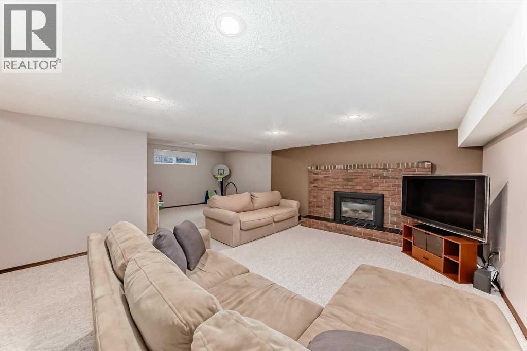 128 Dickenson Crescent, Red Deer, AB - Indoor With Fireplace