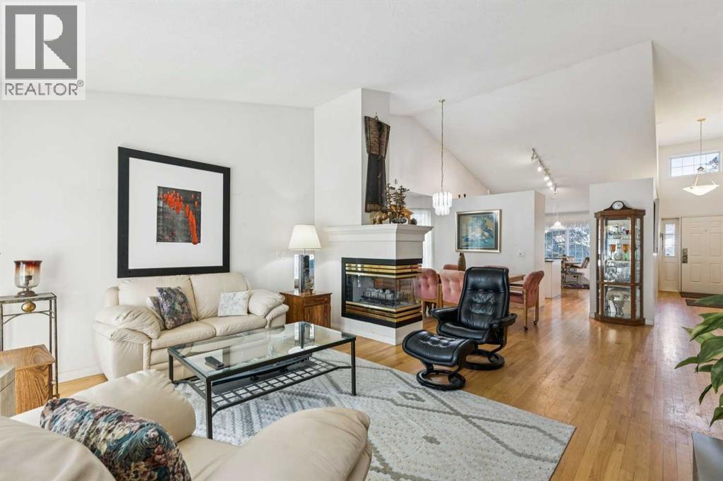312 Prominence Heights Sw, Calgary, AB - Indoor Photo Showing Living Room With Fireplace