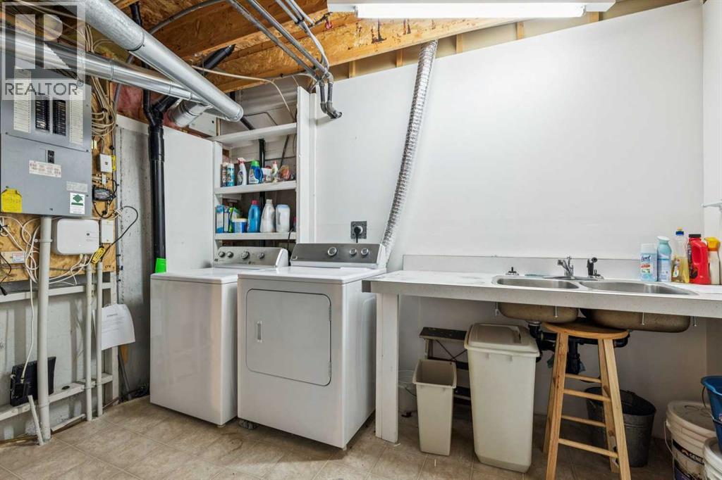 312 Prominence Heights Sw, Calgary, AB - Indoor Photo Showing Laundry Room