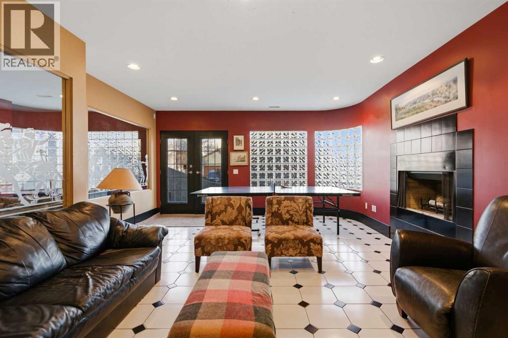 64 Patterson Mews Sw, Calgary, AB - Indoor Photo Showing Living Room With Fireplace