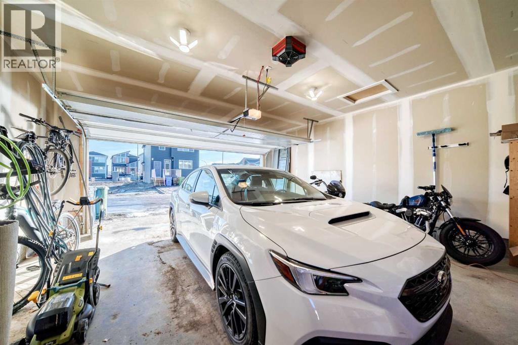 115 Wolf Hollow Park Se, Calgary, AB - Indoor Photo Showing Garage