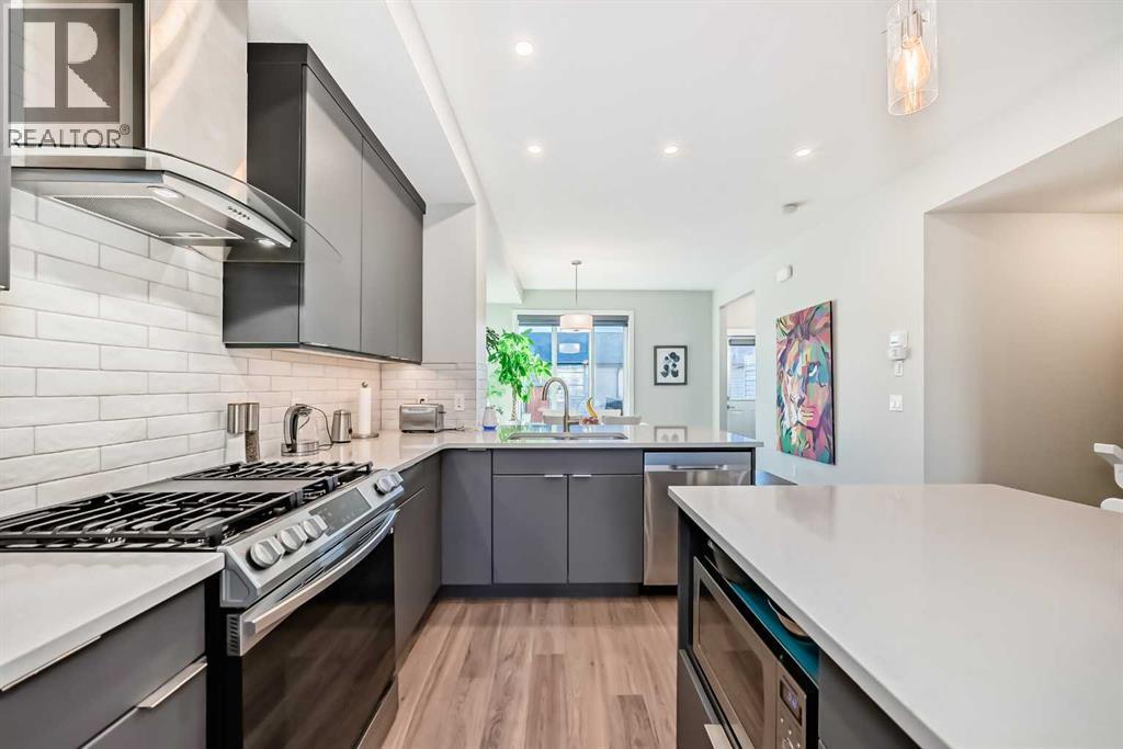 115 Wolf Hollow Park Se, Calgary, AB - Indoor Photo Showing Kitchen With Upgraded Kitchen