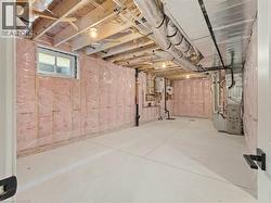 Basement featuring heating unit -
