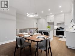 Dining room featuring recessed lighting, baseboards, and light wood-style flooring -