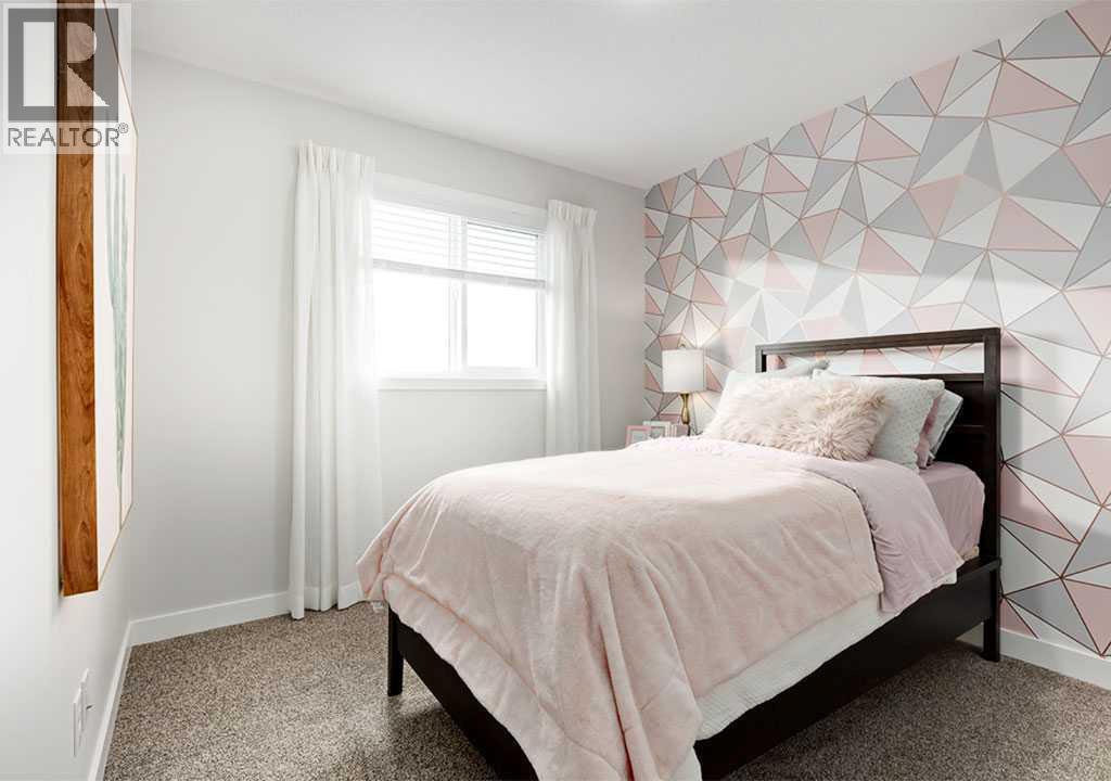 PLEASE NOTE: Photos are of a Showhome of the same model – fit & finish may differ. Interior selections & floorplans shown in photos - 162 Lanark Gate Se, Airdrie, AB - Indoor Photo Showing Bedroom