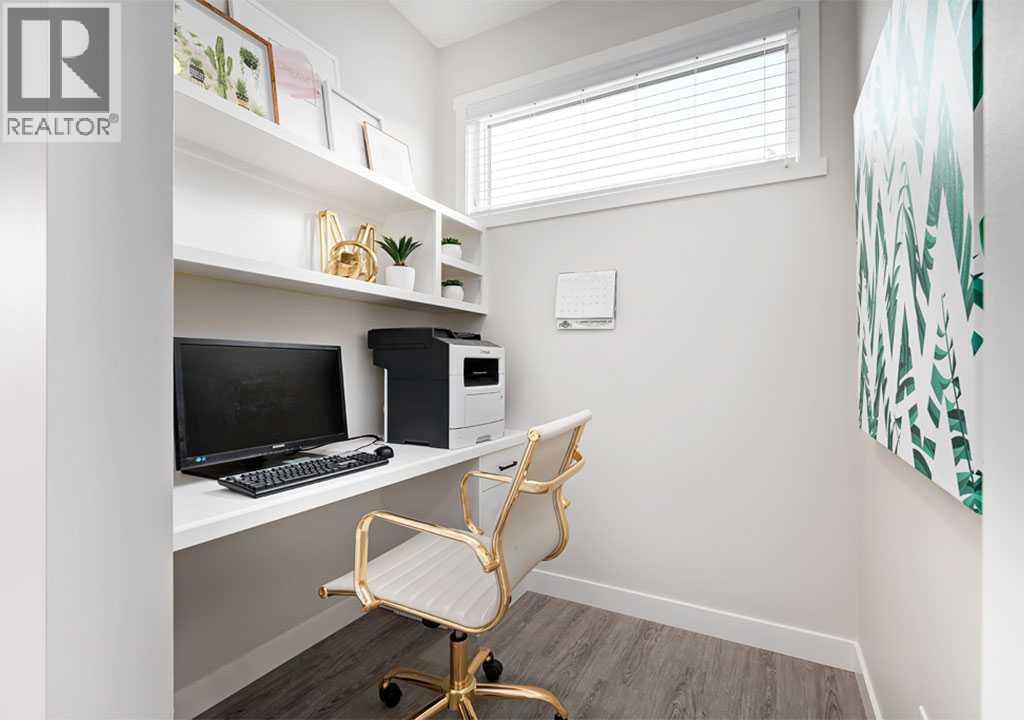 PLEASE NOTE: Photos are of a Showhome of the same model – fit & finish may differ. Interior selections & floorplans shown in photos - 162 Lanark Gate Se, Airdrie, AB - Indoor Photo Showing Office