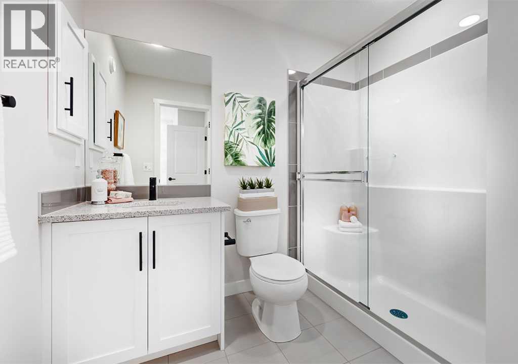 PLEASE NOTE: Photos are of a Showhome of the same model – fit & finish may differ. Interior selections & floorplans shown in photos - 162 Lanark Gate Se, Airdrie, AB - Indoor Photo Showing Bathroom