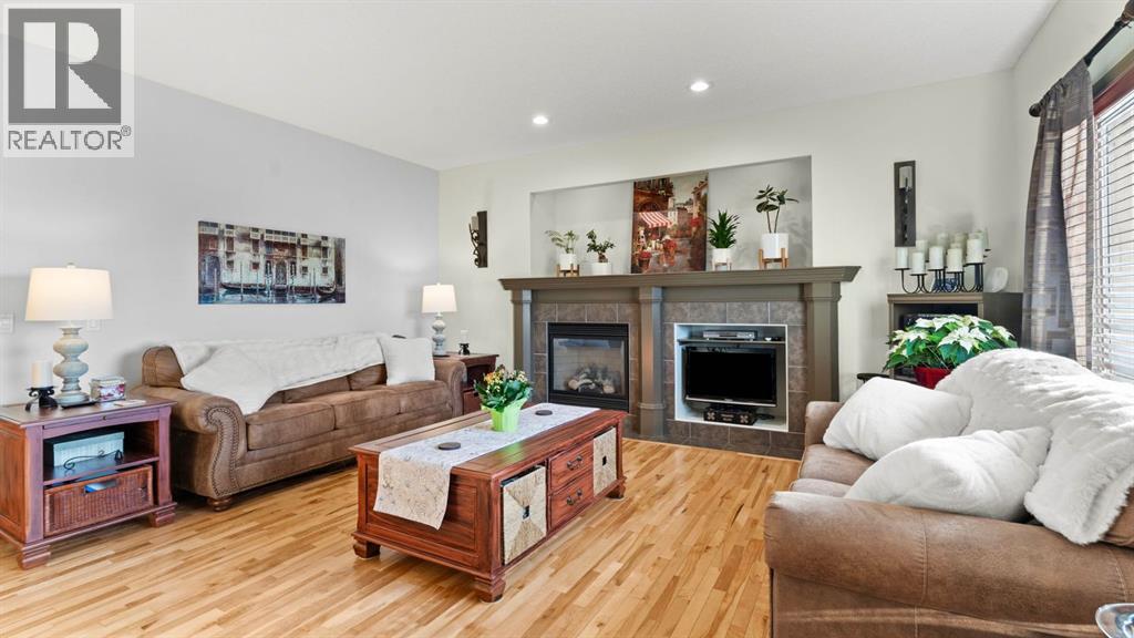189 Rockyspring Terrace Nw, Calgary, AB - Indoor Photo Showing Living Room With Fireplace