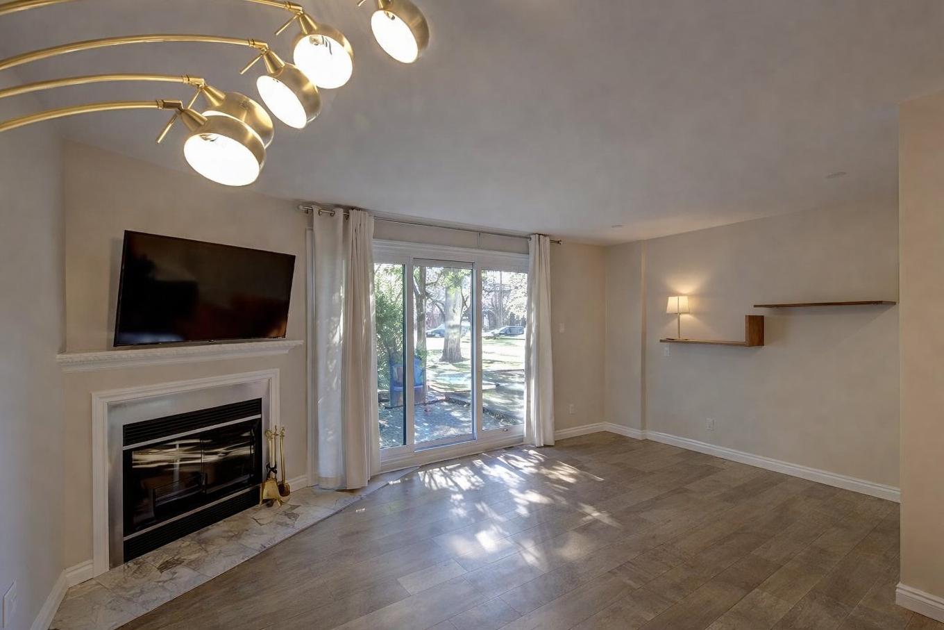 Salon - A-179 Av. De Navarre, Saint-Lambert, QC - Indoor Photo Showing Other Room With Fireplace