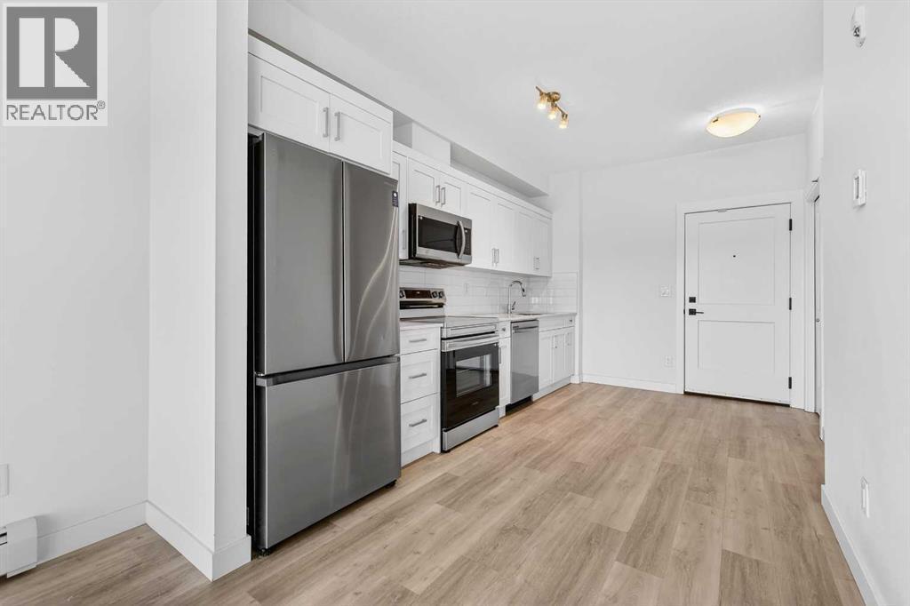 411, 40 Sage Hill Walk Nw, Calgary, AB - Indoor Photo Showing Kitchen With Stainless Steel Kitchen