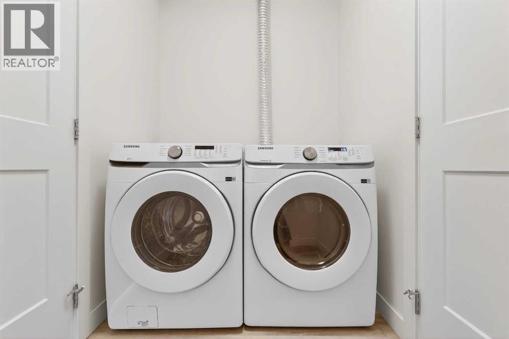 411, 40 Sage Hill Walk Nw, Calgary, AB - Indoor Photo Showing Laundry Room