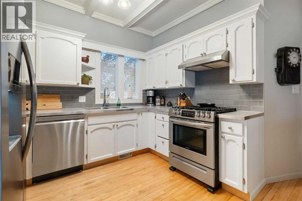 10507 Bradbury Drive Sw, Calgary, AB - Indoor Photo Showing Kitchen With Stainless Steel Kitchen With Double Sink
