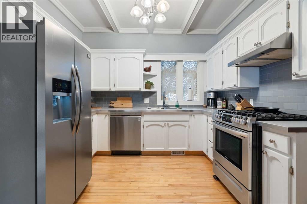 10507 Bradbury Drive Sw, Calgary, AB - Indoor Photo Showing Kitchen With Stainless Steel Kitchen With Double Sink