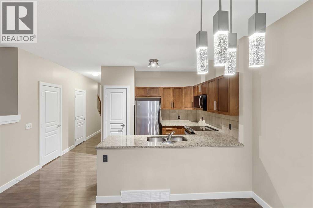 71 Panatella Hill Nw, Calgary, AB - Indoor Photo Showing Kitchen With Double Sink