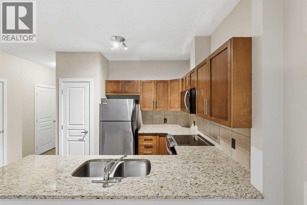 71 Panatella Hill Nw, Calgary, AB - Indoor Photo Showing Kitchen With Double Sink